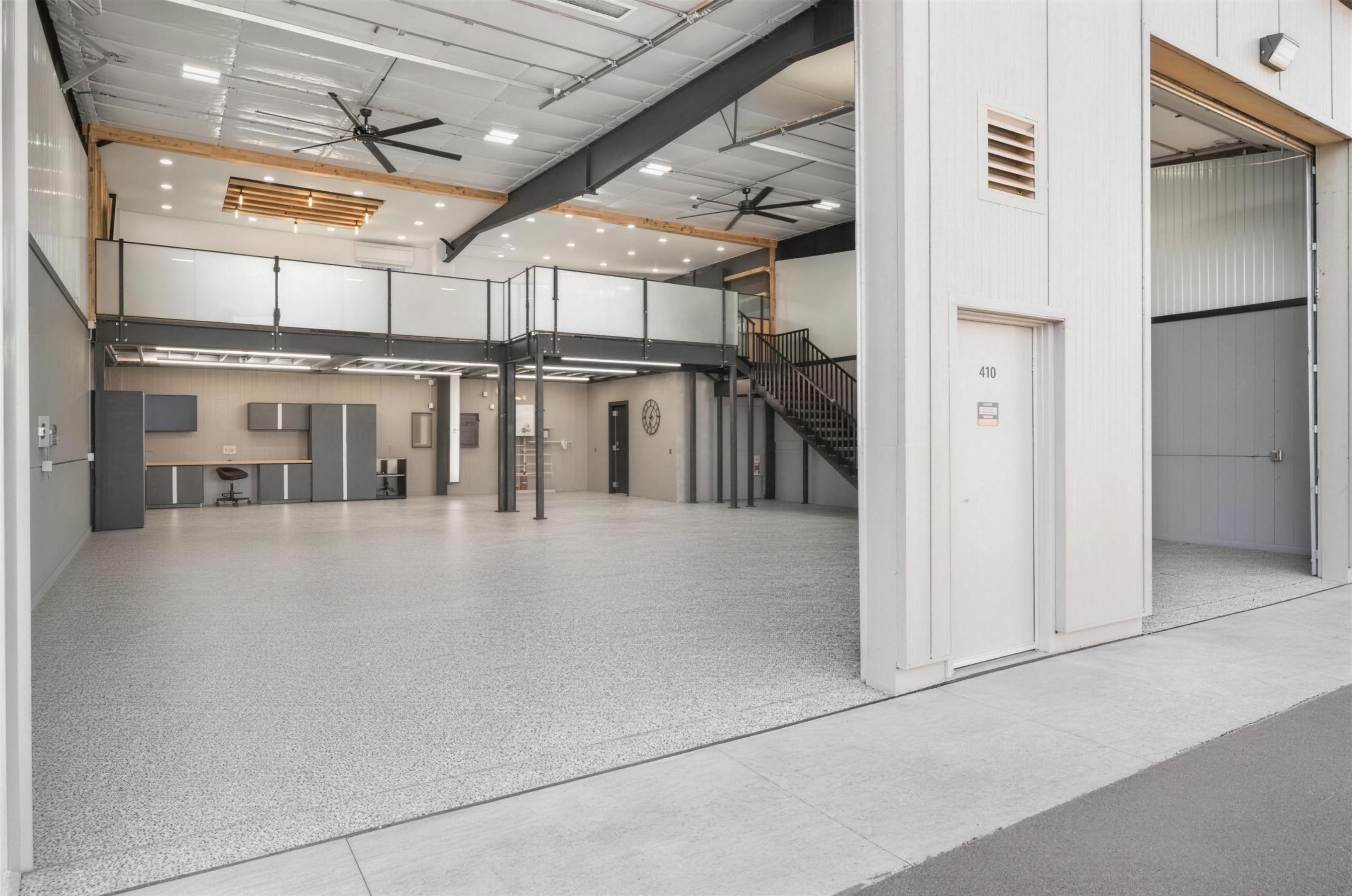 Finished garage condo interior with mezzanine at Troy Condo Garages