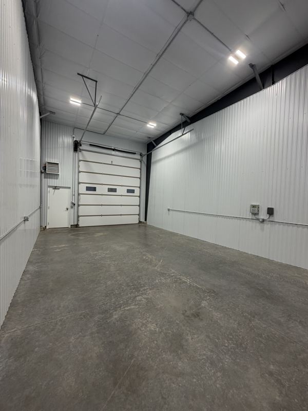 Interior with overhead door and service door